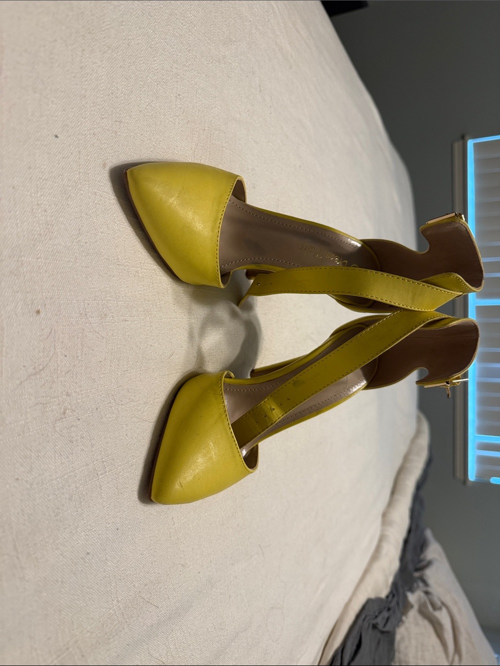 Yellow stilettos with ankle strap